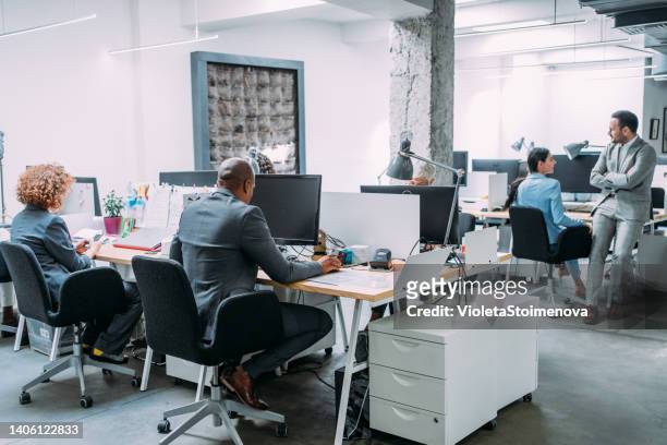 business people working at a modern office. - cubicle work stock pictures, royalty-free photos & images