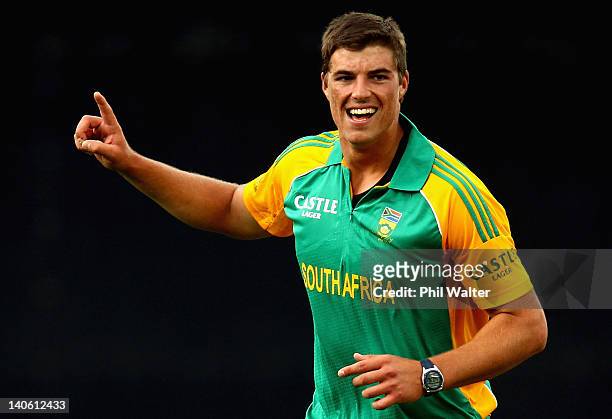 Marchant de Lange of South Africa celebrates his wicket of Nathan McCullum of New Zealand during the One Day International match between New Zealand...