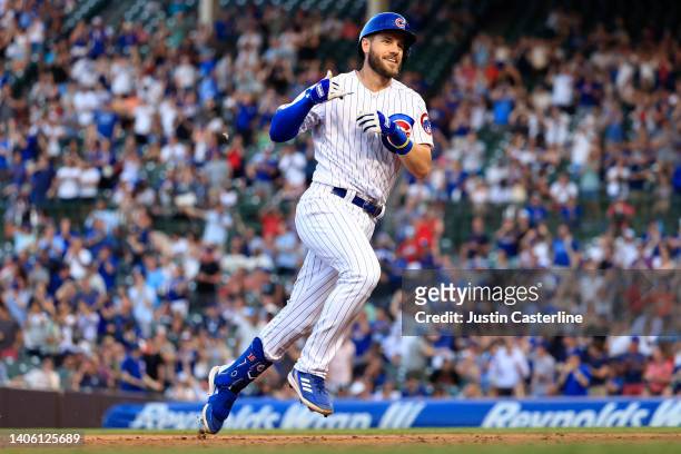 Patrick Wisdom of the Chicago Cubs runs the bases after hitting a grand slam during the second inning in the game against the Cincinnati Reds at...