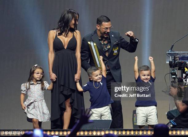 Cub Swanson poses on stage with his family during the UFC Hall of Fame induction ceremony at T-Mobile Arena on June 30, 2022 in Las Vegas, Nevada.