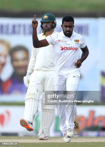 Asitha Fernando of Sri Lanka celebrates after dismissing Pat Cummins of Australia during day three of the First Test in the series between Sri Lanka...