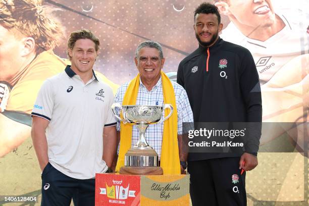Wallabies captain Michael Hooper, former Wallaby Mark Ella and England captain Courtney Lawes pose with the Ella-Mobbs Cup during a media opportunity...