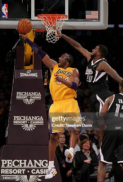 Kobe Bryant of the Los Angeles Lakers scores a basket against donte Greene of the Sacramento Kings at Staples Center on March 2, 2012 in Los Angeles,...