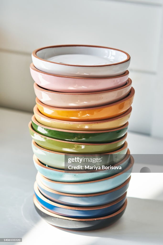A stack of ceramics on a white background.
