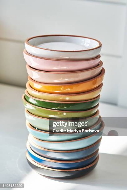 a stack of ceramics on a white background. - ceramic stockfoto's en -beelden