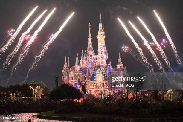 Fireworks explode over the Enchanted Storybook Castle at the Shanghai Disney Resort on the reopening day on June 30, 2022 in Shanghai, China....