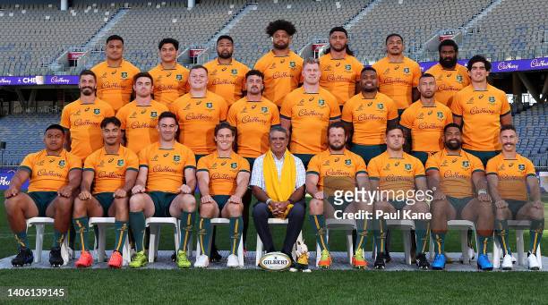 Former Wallaby Mark Ella sits in with the Wallabies team as they pose for a team photograph during the Australian Wallabies captain's run at Optus...