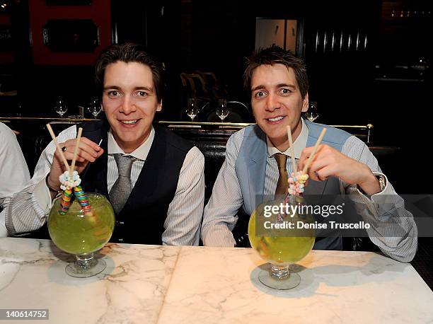 James Phelps and Oliver Phelps dine at Sugar Factory American Brasserie at Paris Las Vegas on March 2, 2012 in Las Vegas, Nevada.