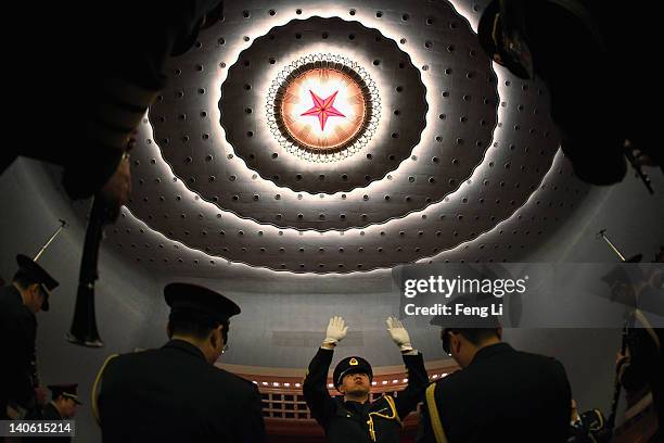 Members from a military band perform during the rehearsal ahead of the opening ceremony of the Chinese People's Political Consultative Conference at...