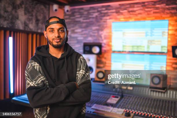portrait of african-american male musician in recording studio - radio dj stock pictures, royalty-free photos & images