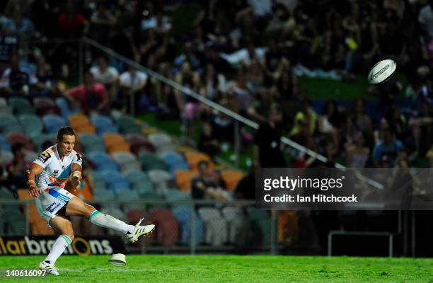 Scott Prince of the Titans kicks the ball during the round one NRL match between the North Queensland Cowboys and the Gold Coast Titans at Dairy...