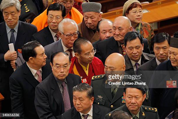 The Panchen Lama , the second highest Tibetan Buddhist leader, leaves after the opening session of the 11th National Committee of the Chinese...