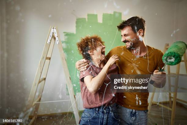 messy house painting! - couple painting bildbanksfoton och bilder