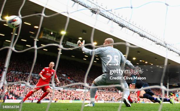 Robin van Persie of Arsenal heads the ball and scores the equalising goal past Jose Reina of Liverpool during the Barclays Premier League match...