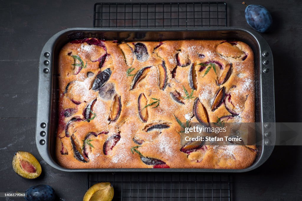 Baked cake with plums and marijuana leaf