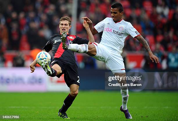 Daniel Schwaab of Leverkusen is challenged by Luiz Gustavo of Muenchen during the Bundesliga match between Bayer 04 Leverkusen and FC Bayern Muenchen...