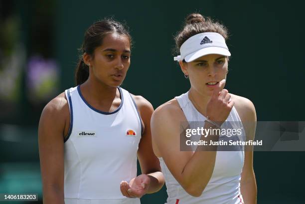 Naiktha Bains and partner Maia Lumsden of Great Britain interact during their Women's Doubles Second Round match against Shuko Aoyama of Japan and...