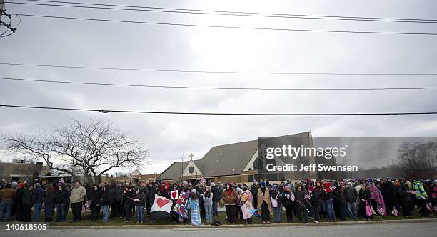 Crowd of well-wishers stand along the road in front of St Mary's Church to pay respect for Danny Parmertor on March 3, 2012 in Chardon, Ohio....