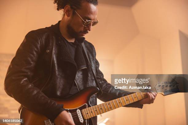 male rock session guitarist recording guitar in a recording studio - country concert stock pictures, royalty-free photos & images