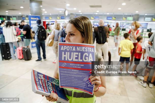 Ryanair worker with posters during a rally at Terminal 1 of Adolfo Suarez Madrid Barajas Airport, July 1 in Madrid, Spain. As every year, the start...