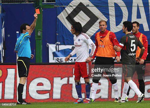 Paolo Guerrero of Hamburg gets the red card from referee Peter Sippel during the Bundesliga match between Hamburger SV and VfB Stuttgart at Imtech...