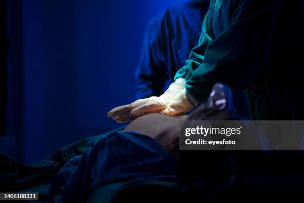 doctors are surgery to patient at operating room. - cpr stock pictures, royalty-free photos & images