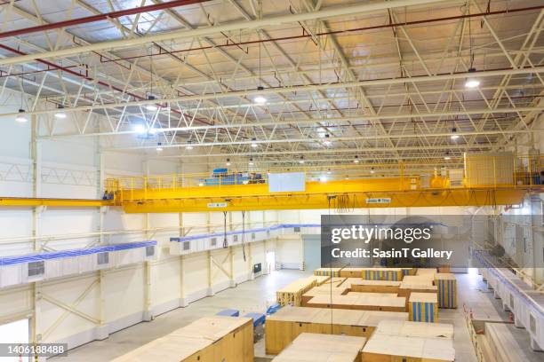 overhead crane inside factory building - overhead crane stock pictures, royalty-free photos & images