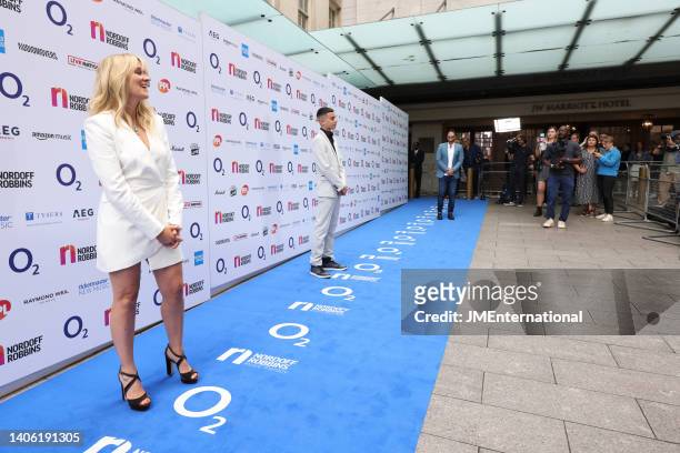 Edith Bowman and Junior arrive at the Nordoff Robbins O2 Silver Clef Awards at The Grosvenor House Hotel on July 01, 2022 in London, England.