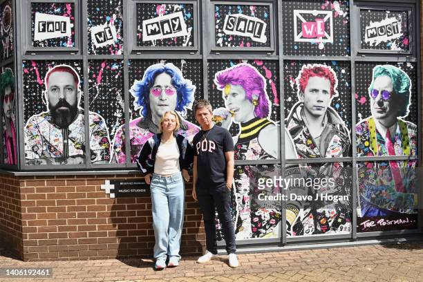 Noel Gallagher and daughter Anais Gallagher pose for a portrait as artists The Postman install a larger than life mural for Noel Gallagher at his...