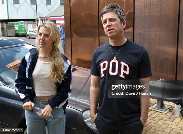 Noel Gallagher and daughter Anais Gallagher look-on as artists The Postman install a larger than life mural for Noel Gallagher at his North London...