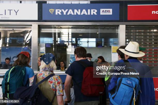 Several people approach the windows of the airline Ryanair, whose workers are on strike these days over their working conditions at the Costa del Sol...