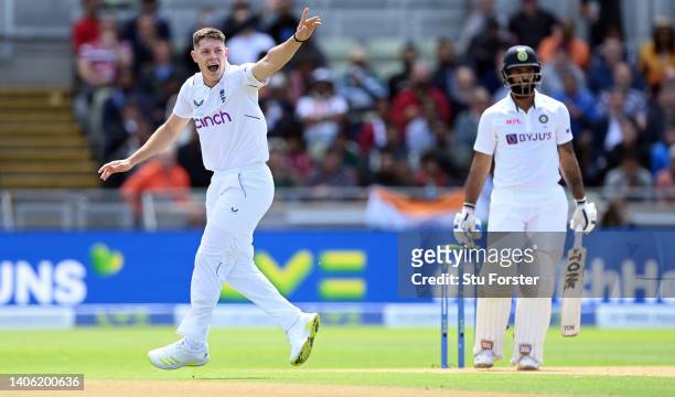 England bowler Matthew Potts appeals with success after taking the wicket of India batsman Hanuma Vihari drives for runs during day one of the 5th...