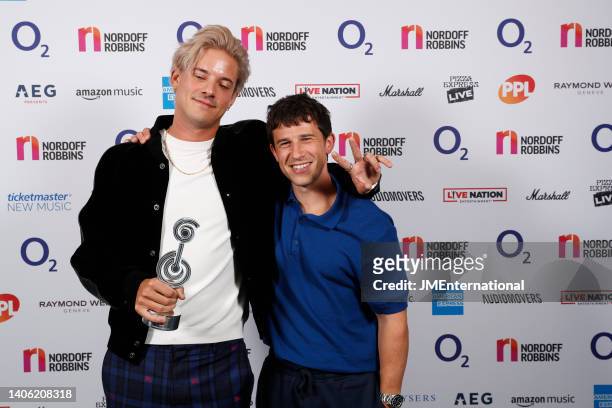 London Grammar win the Best Group Award at the Nordoff Robbins O2 Silver Clef Awards at The Grosvenor House Hotel on July 01, 2022 in London, England.