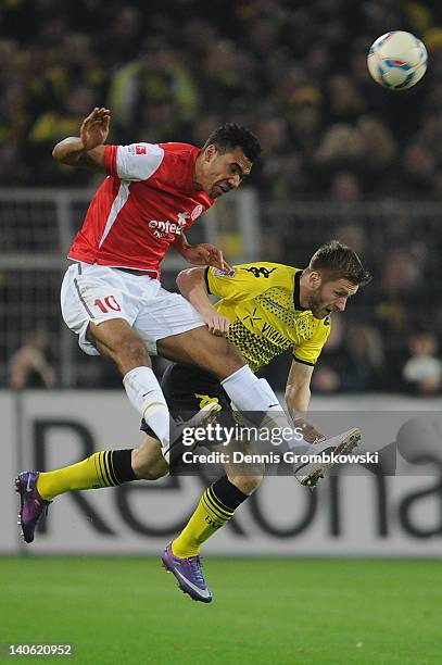 Eric Maxim Choupo-Moting of Mainz and Jakub Blaszczykowski of Dortmund battle for the ball during the Bundesliga match between Borussia Dortmund and...