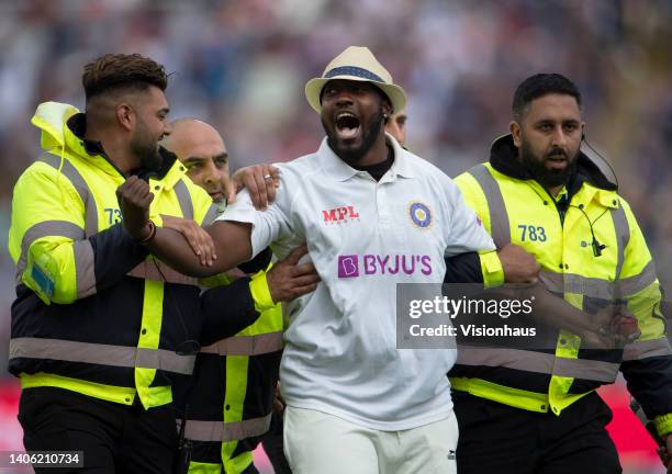 Pitch invader Jarvo is escorted off the field by security staff during the first day of the fifth LV= Insurance Test Match between England and India...