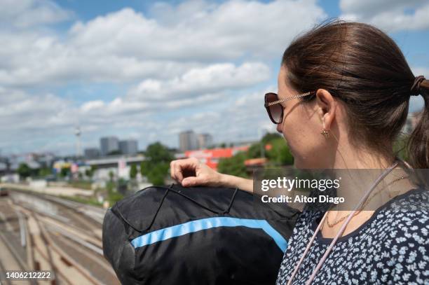 tourist  looking at something in vacations close to a train station . berlin, germany. - transportation building type of building stock pictures, royalty-free photos & images