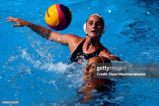 Madeline Musselman of Team United States passes the ball over Judith Forca Ariza of Team Spain during the Women's Water Polo Quarter Final match...