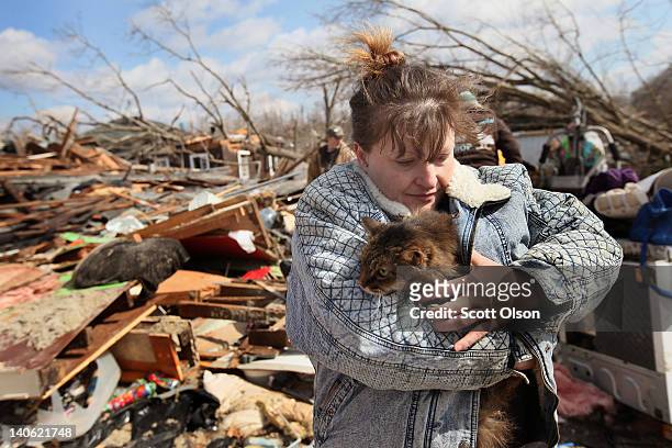 Melody Zollman hugs her cat Thumbelina after it was pulled from the debris of her home, which was destroyed by a tornado March 3, 2012 in Henryville,...