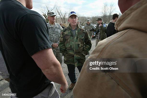 Indiana Gov. Mitch Daniels talks to students outside the Henryville School during a vist to the tornado-ravaged town March 3, 2012 in Henryville,...