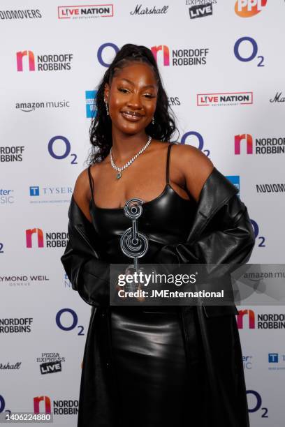 Tems wins the Best International Award at the Nordoff Robbins O2 Silver Clef Awards at The Grosvenor House Hotel on July 01, 2022 in London, England.