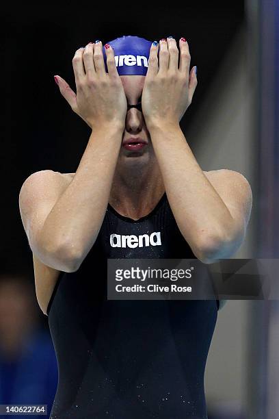 Fran Halsall of Loughborough University adjusts her goggles in the Women's Open 100m Butterfly Semi Final during day one of the British Gas Swimming...