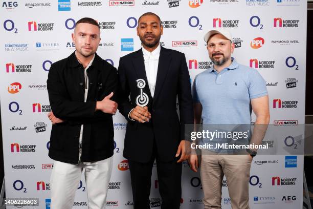 Kano in the Winners room with his sponsors from Audiomovers at the Nordoff Robbins O2 Silver Clef Awards at The Grosvenor House Hotel on July 01,...