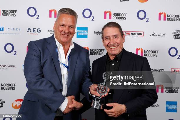 Jools Holland in the Winners Room with his sponsors from Tysers at the Nordoff Robbins O2 Silver Clef Awards at The Grosvenor House Hotel on July 01,...