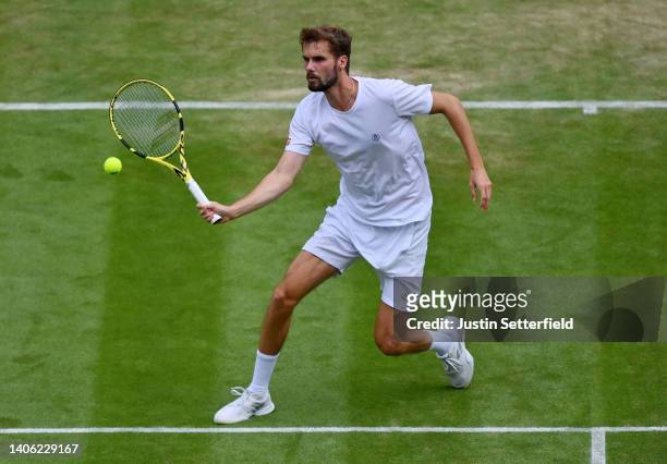 Oscar Otte of Germany plays a forehand against Carlos Alcaraz of Spain during their Men's Singles Third Round match on day five of The Championships...