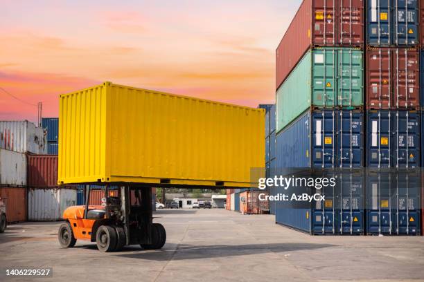 crane lifting up container in yard - cargo container texture stock pictures, royalty-free photos & images