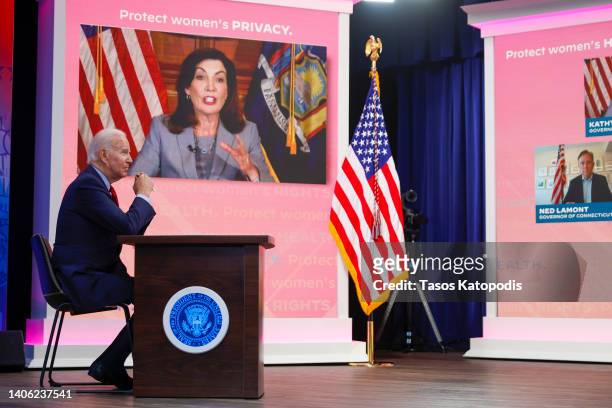 President Joe Biden listens to Governor of New York Kathy Hochul speak during a call with governors on protecting access to reproductive Health Care...