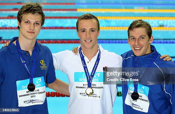 Gold medallist Robert Renwick of the City of Glasgow celebrates with silver medallist David Carry of Stockport and bronze medallist Ieuan Lloyd of...