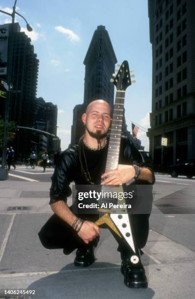 Guitarist C.J. Pierce of the band Drowning Pool appears in a portrait with his Gibson Flying V model guitar on May 10, 2001 in the Flatiron District...