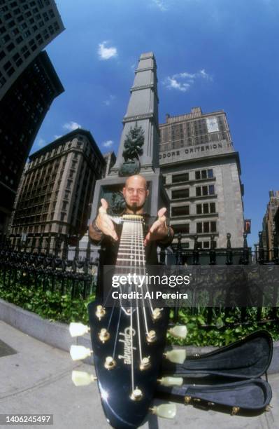Guitarist C.J. Pierce of the band Drowning Pool appears in a portrait with his Gibson Flying V model guitar on May 10, 2001 in the Flatiron District...