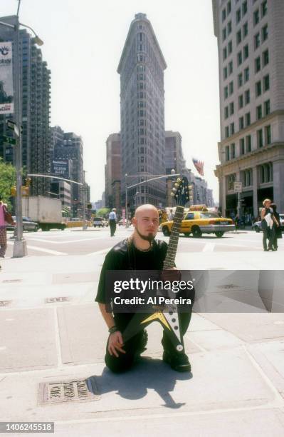 Guitarist C.J. Pierce of the band Drowning Pool appears in a portrait with his Gibson Flying V model guitar on May 10, 2001 in the Flatiron District...